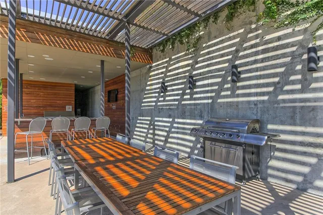 a outdoor sitting area with furniture and wooden floor