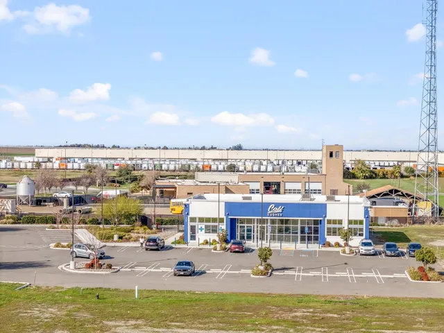 a view of a swimming pool with outdoor seating