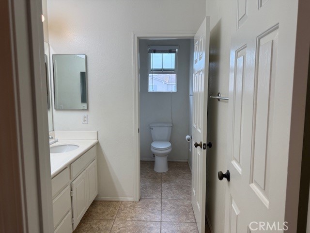 13272 Cool Meadow Drive Eastvale, CA 92880 - Photo 12 of 15 a spacious bathroom with a toilet sink and shower