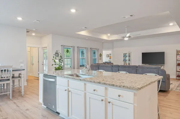 a view of living room and chandelier