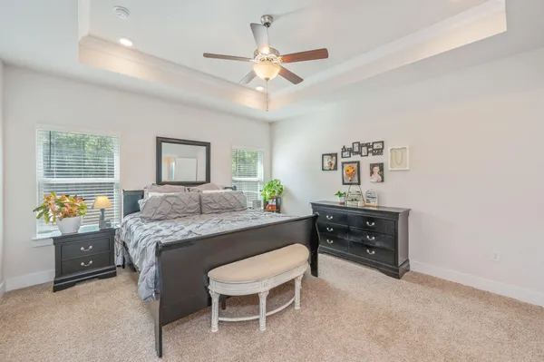a living room with a bed and furniture