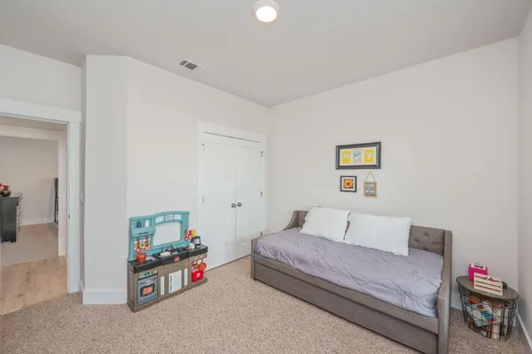 a bedroom with furniture and a bed