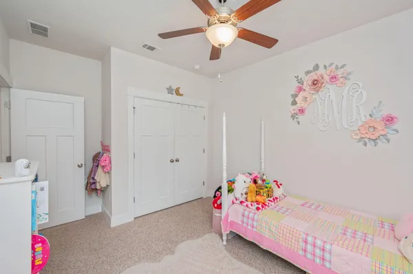 a bedroom with furniture and a chandelier