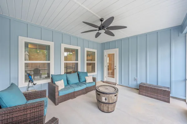 a living room with furniture and a window