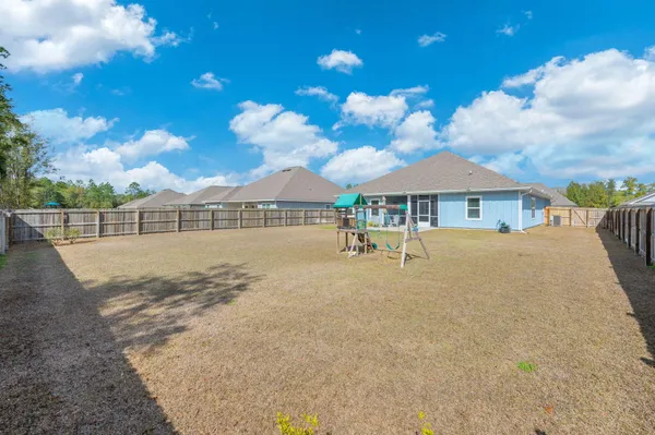 a view of house with outdoor space and sitting area