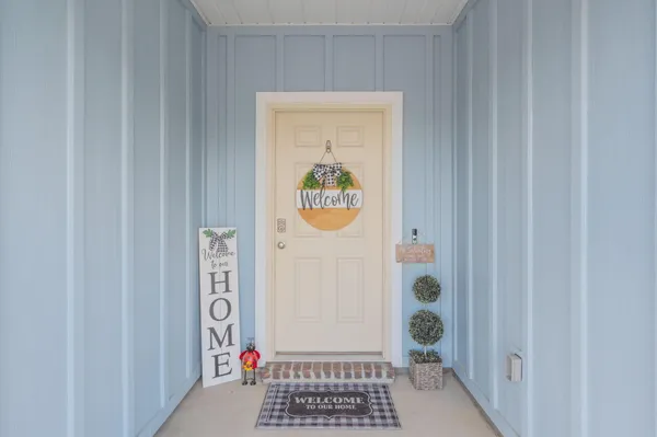 a view of a hallway with bathroom