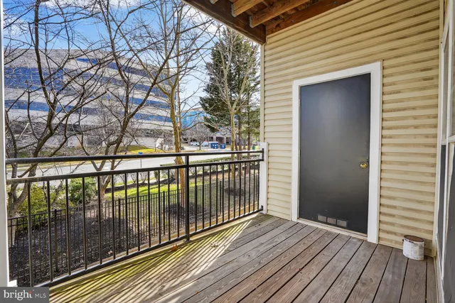a view of wooden balcony with wooden floor and fence