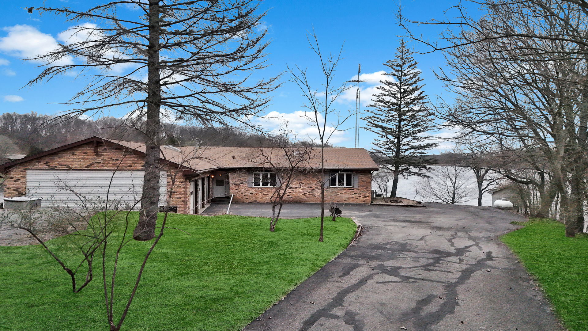 20 Chairtree Court Putnam, IL 61560 - Photo 3 of 10 a view of a patio with a table and chairs under an umbrella