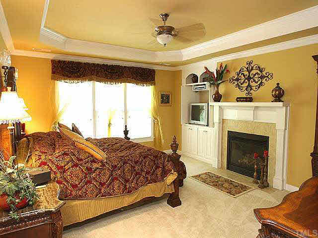 8810 Fidelis Lane Raleigh, NC 27613 - Photo 6 of 10 a spacious bedroom with a bed and a window