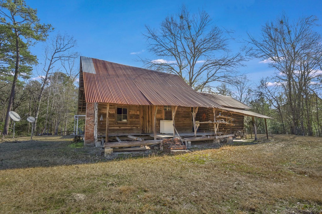 893 Capps Road Huntington, TX 75949 - Photo 13 of 32 a view of a house with a yard and sitting area