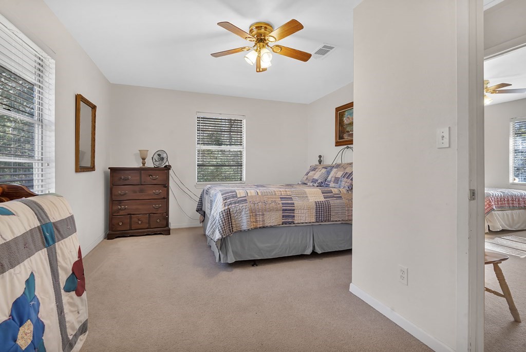 893 Capps Road Huntington, TX 75949 - Photo 10 of 32 a bedroom with furniture and window