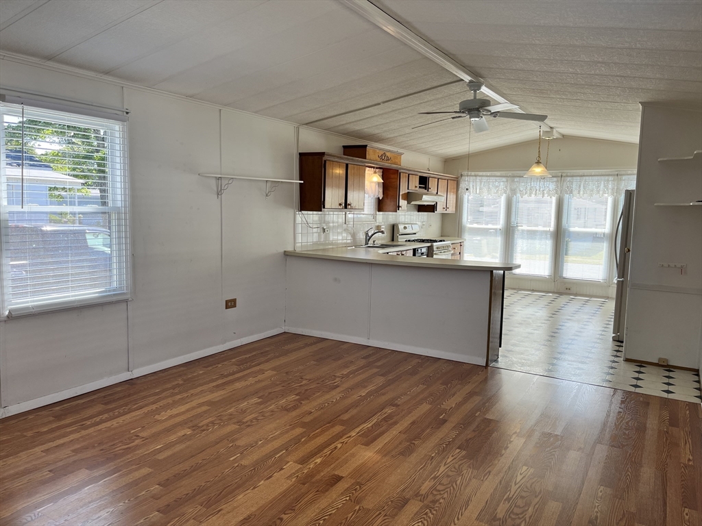4 Joseph Street Wareham, MA 02538 - Photo 11 of 23 a view of a kitchen with a sink and wooden floor
