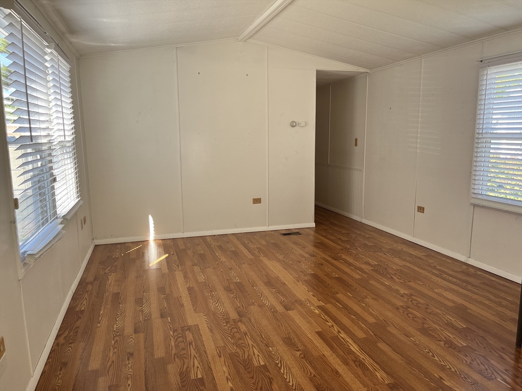 4 Joseph Street Wareham, MA 02538 - Photo 12 of 23 an empty room with wooden floor and windows