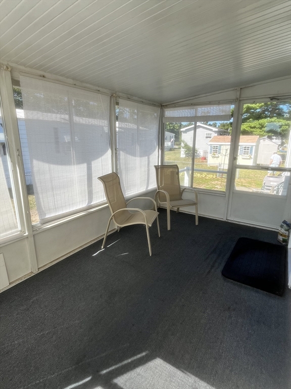 4 Joseph Street Wareham, MA 02538 - Photo 20 of 23 a room with a balcony a bed and a large window