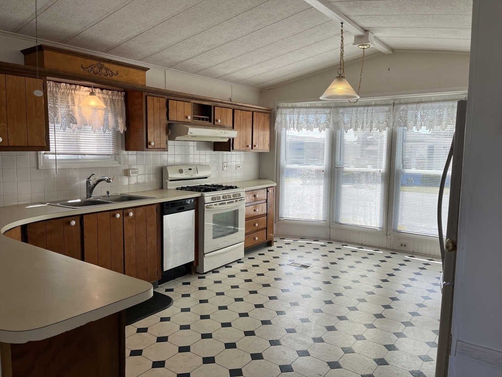 4 Joseph Street Wareham, MA 02538 - Photo 6 of 16 a kitchen with a sink a stove and a refrigerator