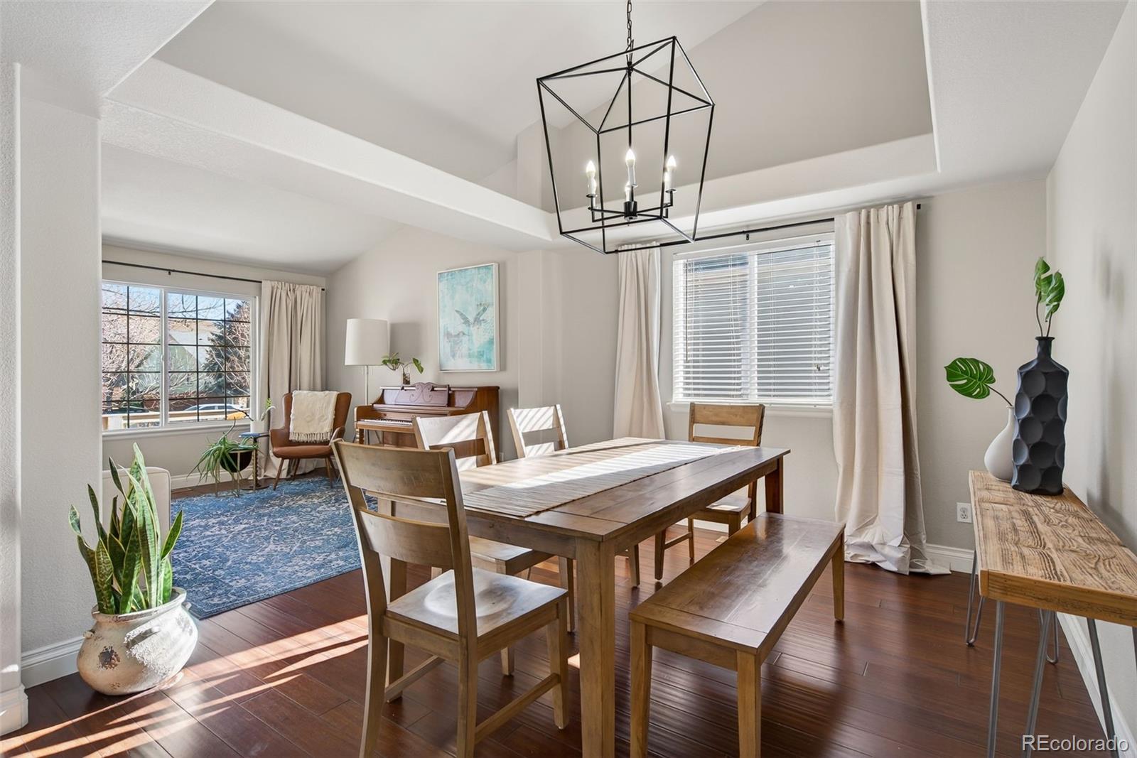 6737 Thistle Ridge Avenue Firestone, CO 80504 - Photo 12 of 39 a view of a dining room with furniture window and wooden floor