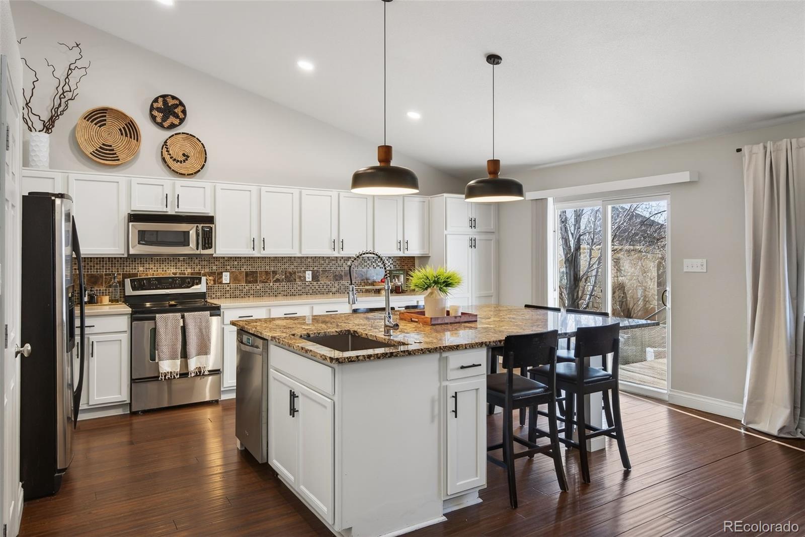 6737 Thistle Ridge Avenue Firestone, CO 80504 - Photo 2 of 39 a kitchen with a counter space a sink and appliances