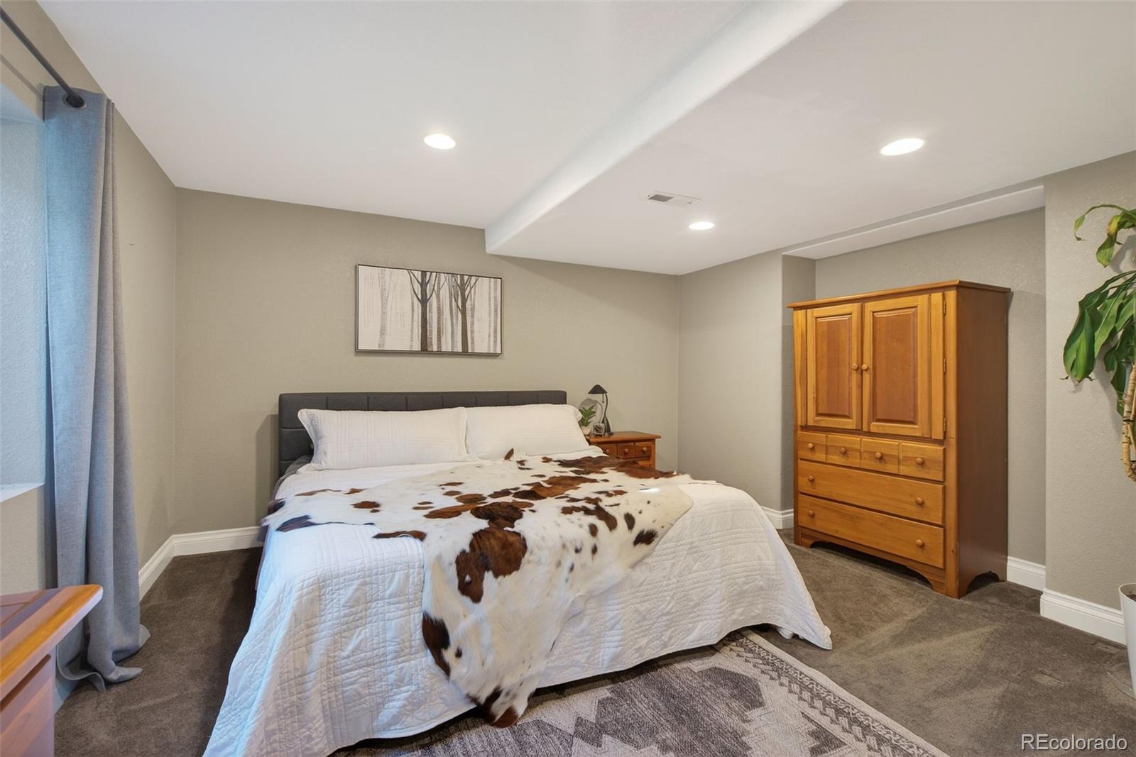 6737 Thistle Ridge Avenue Firestone, CO 80504 - Photo 28 of 39 a bed room with a bed and a window