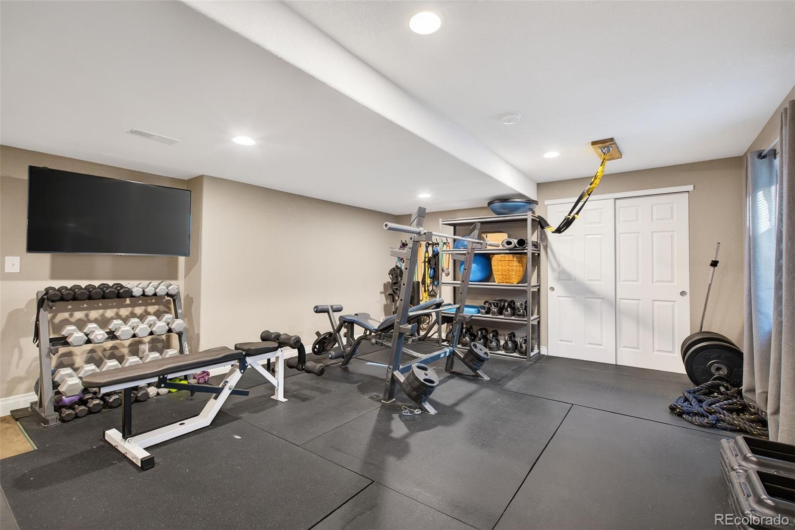 6737 Thistle Ridge Avenue Firestone, CO 80504 - Photo 31 of 39 a view of a room with gym equipment