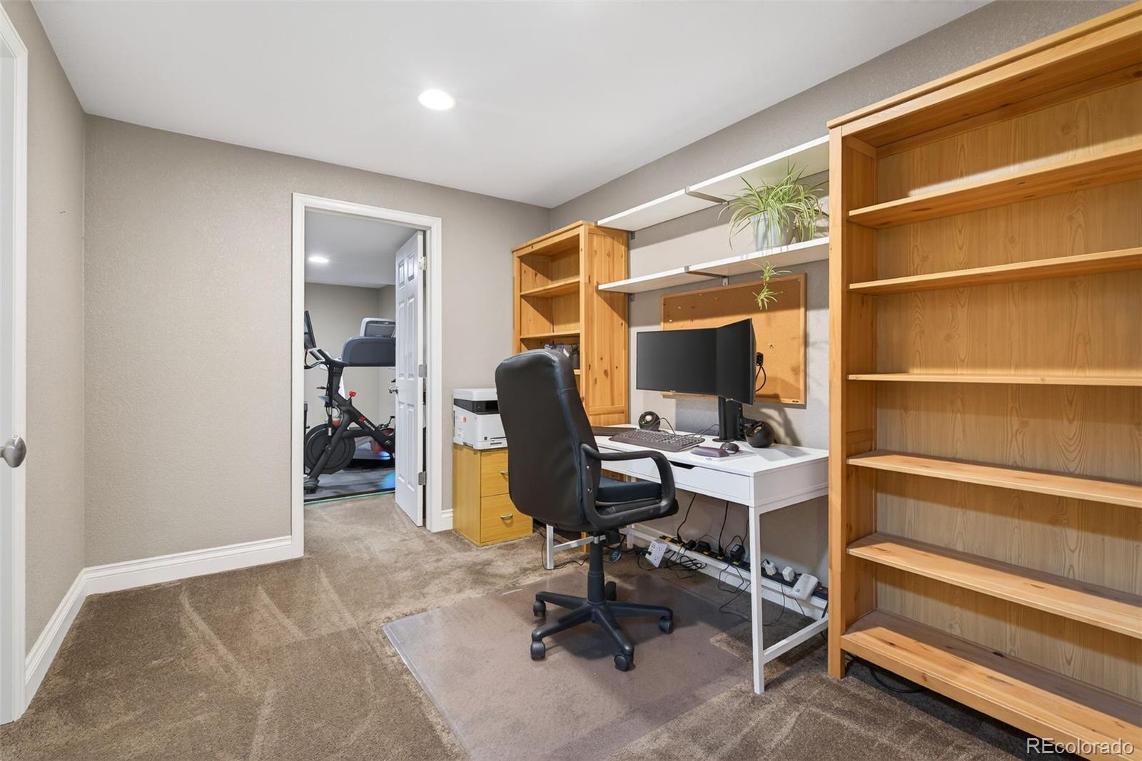6737 Thistle Ridge Avenue Firestone, CO 80504 - Photo 32 of 39 a view of a workspace with furniture and a window