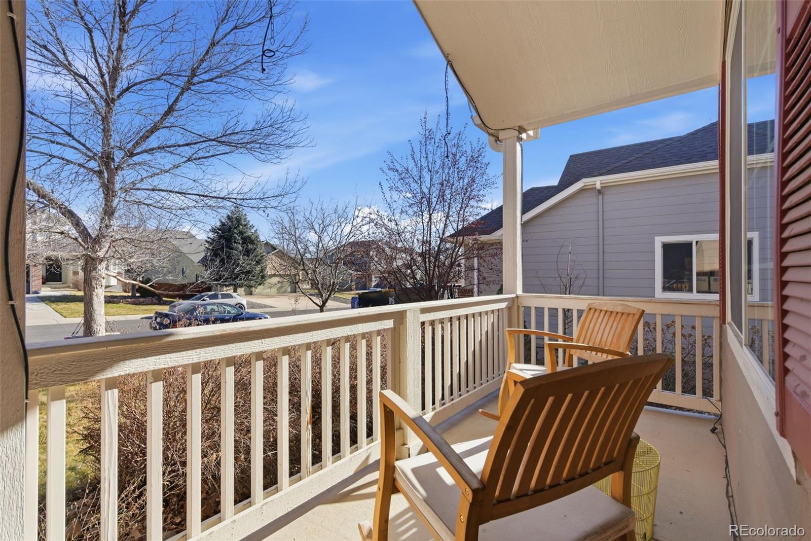 6737 Thistle Ridge Avenue Firestone, CO 80504 - Photo 5 of 39 a view of a chair and tables in the balcony