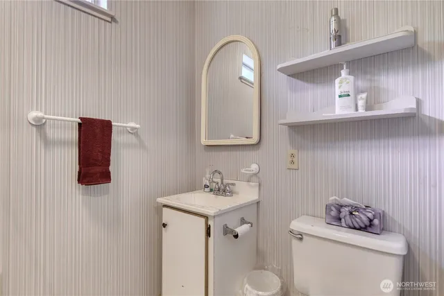 a bedroom with two beds and a window