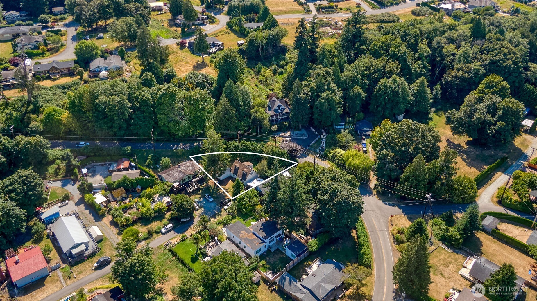 2145 Fir Street Point Roberts, WA 98281 - Photo 29 of 36 an aerial view of a house with a yard and lake view