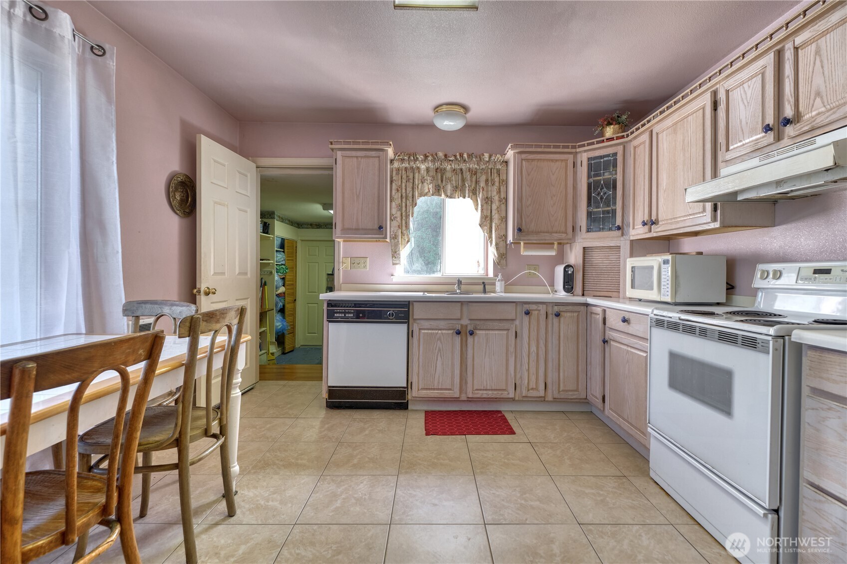2145 Fir Street Point Roberts, WA 98281 - Photo 6 of 36 a kitchen with stainless steel appliances granite countertop a sink and cabinets