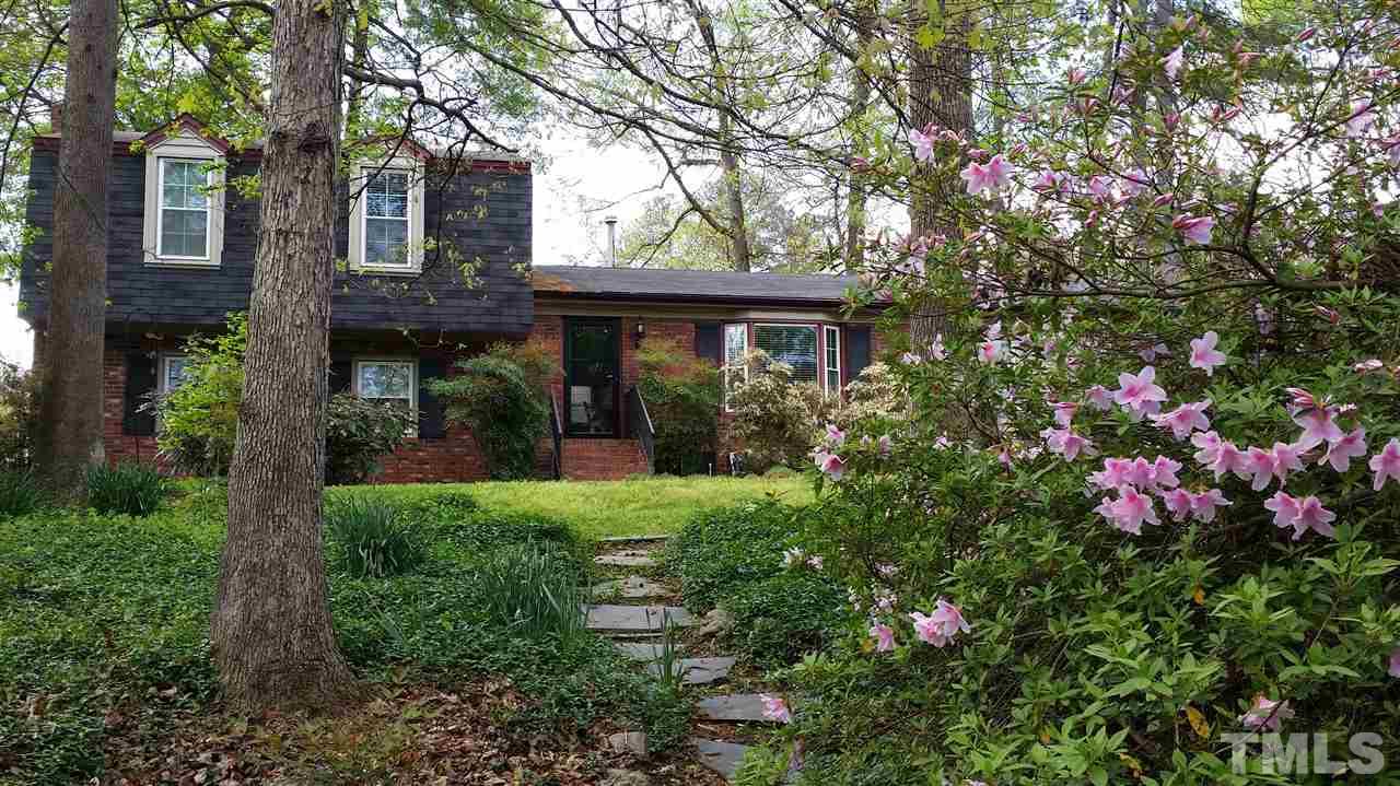 3901 Pin Oak Road Raleigh, NC 27604 - Photo 1 of 24 a view of a house with potted plants and large trees