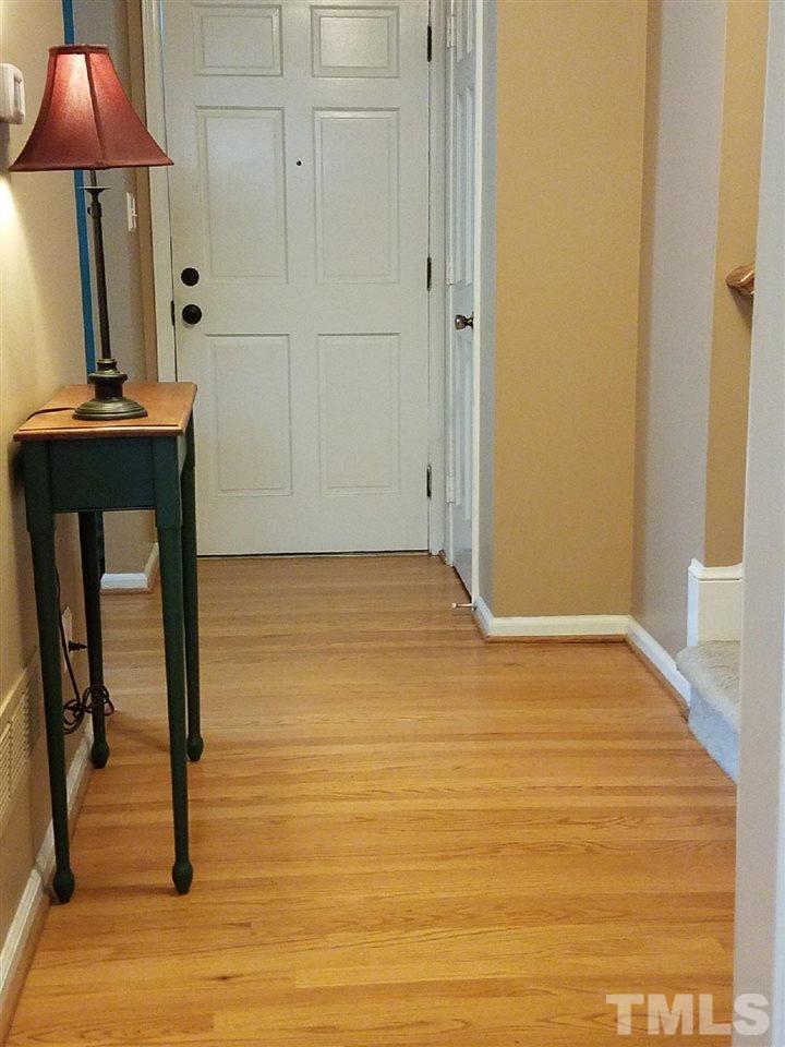 3901 Pin Oak Road Raleigh, NC 27604 - Photo 2 of 24 a view of a room with wooden floor and table