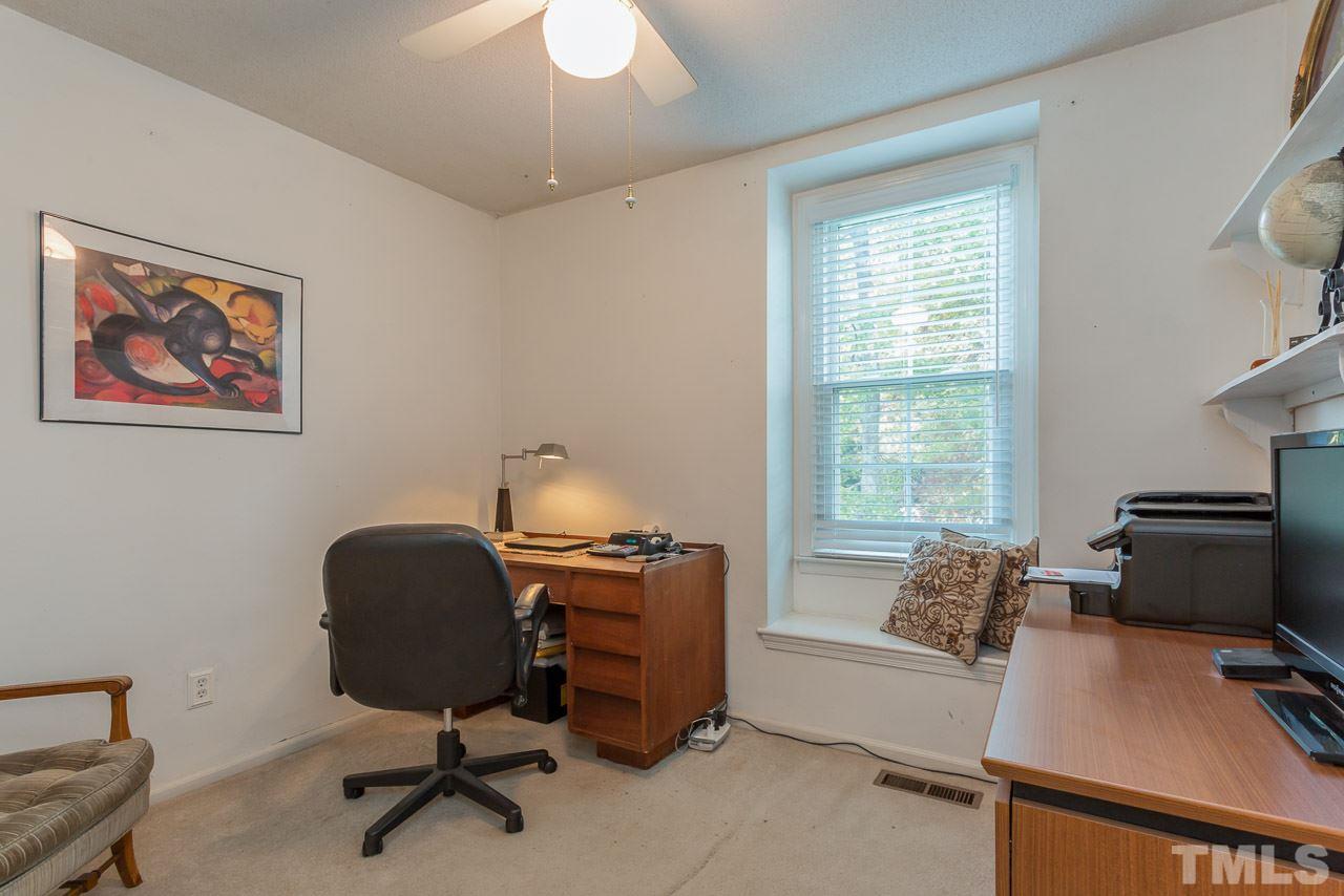 3901 Pin Oak Road Raleigh, NC 27604 - Photo 12 of 24 a livingroom with workspace and a window