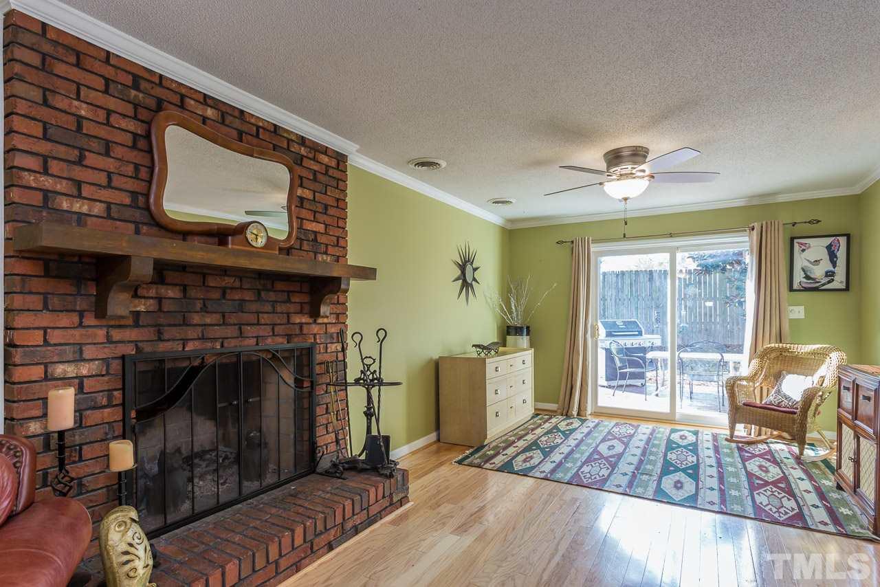 3901 Pin Oak Road Raleigh, NC 27604 - Photo 17 of 24 a living room with furniture and a fireplace