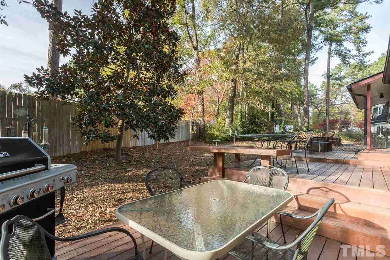3901 Pin Oak Road Raleigh, NC 27604 - Photo 19 of 24 a backyard of a house with fire pit and furniture