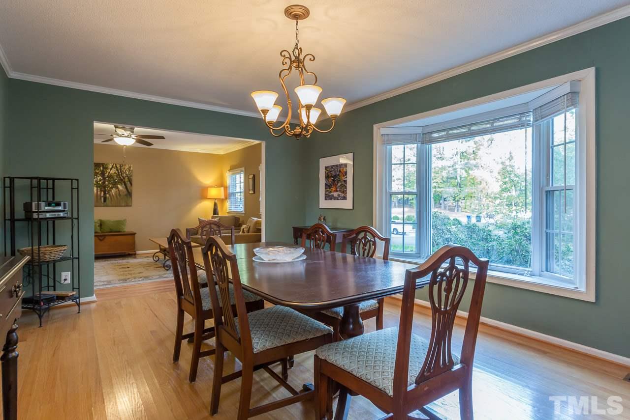 3901 Pin Oak Road Raleigh, NC 27604 - Photo 3 of 24 a view of a dining room with furniture window and wooden floor