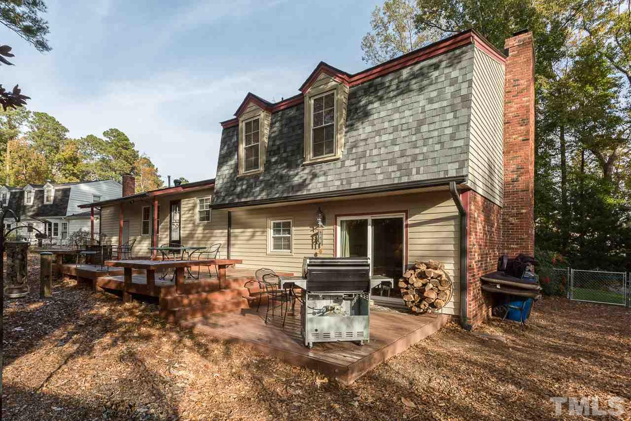 3901 Pin Oak Road Raleigh, NC 27604 - Photo 21 of 24 a view of a house with a chairs in patio