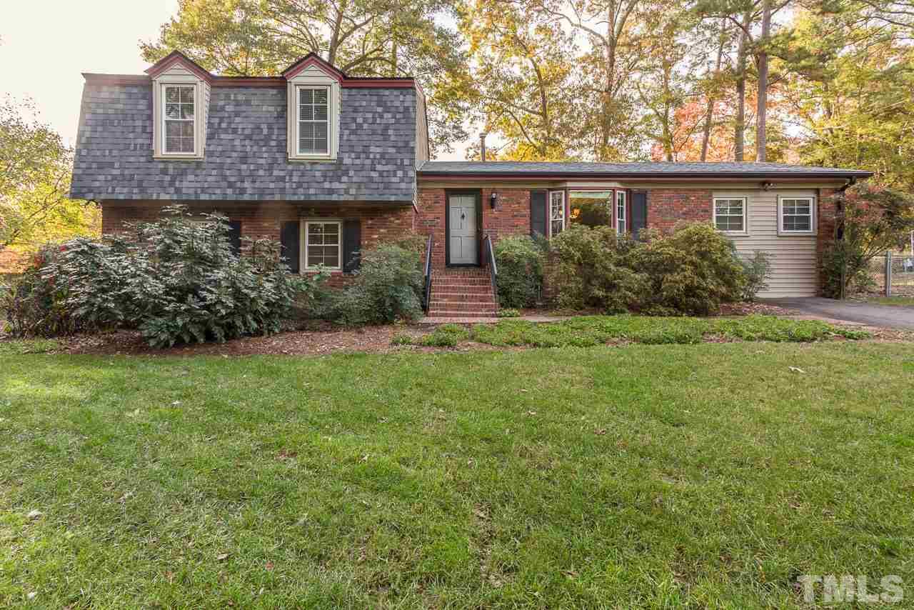 3901 Pin Oak Road Raleigh, NC 27604 - Photo 24 of 24 a front view of a house with a garden and yard