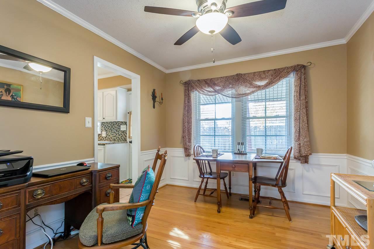 3901 Pin Oak Road Raleigh, NC 27604 - Photo 7 of 24 a view of a dining room with furniture window and wooden floor