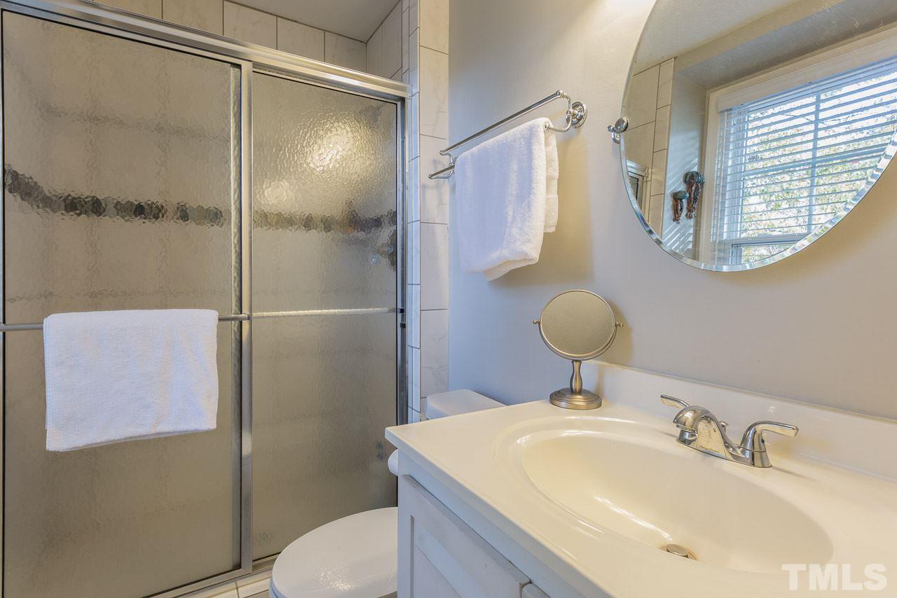 3901 Pin Oak Road Raleigh, NC 27604 - Photo 10 of 24 a bathroom with a sink toilet and shower