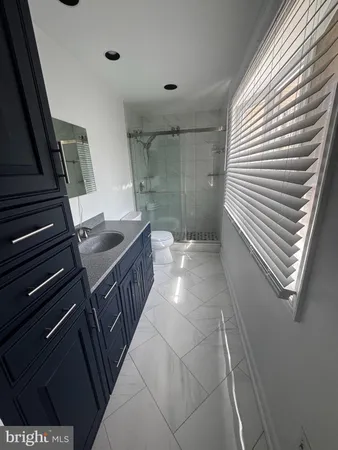 a bathroom with a sink and mirror