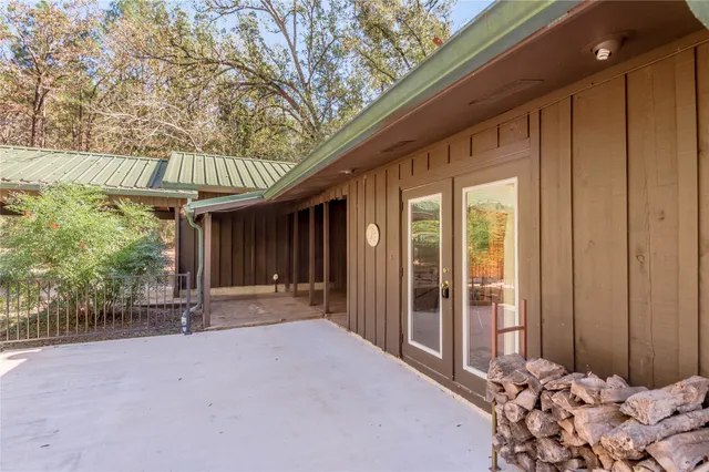 a view of a room with wooden floor and windows