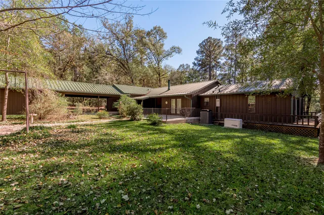 a view of balcony with wooden floor and fence