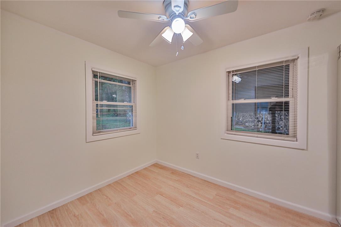 5599 Minks Pond Road Bushkill, PA 18324 - Photo 26 of 64 Hardwood floors and generous windows elevate this comfortable bedroom space.