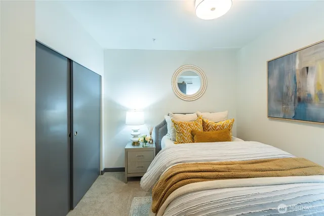 a view of bathroom with a toilet sink and mirror