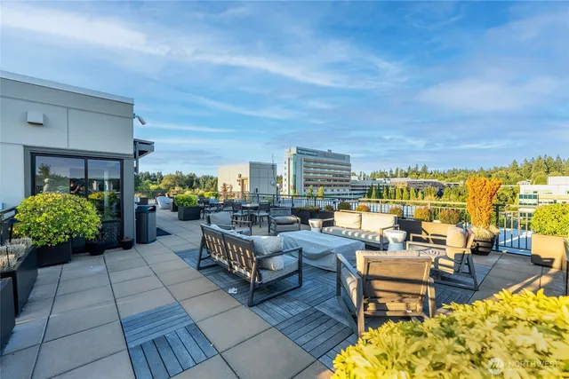 a living room with furniture and a view of city