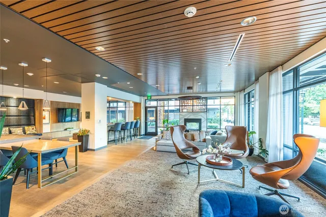 a kitchen with stainless steel appliances kitchen island granite countertop a sink and counter space