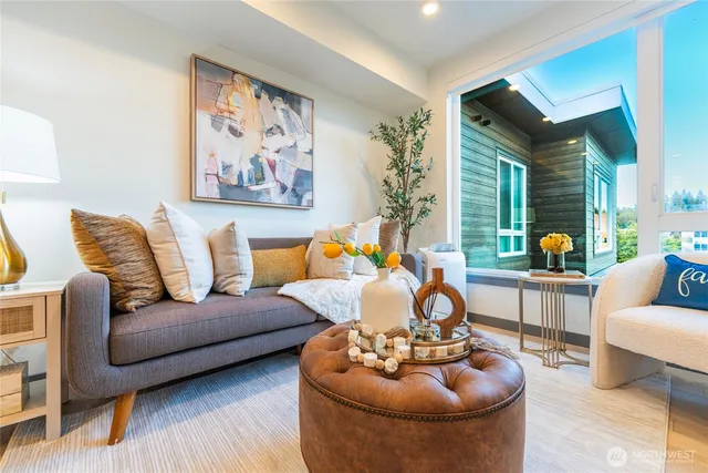 a kitchen with stainless steel appliances granite countertop a sink a stove and cabinets