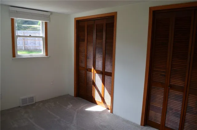 a view of an empty room with windows