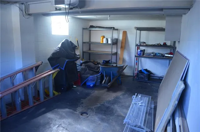 a view of a white house with a sink and a floor to ceiling window