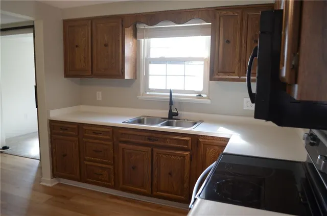a kitchen with a sink and cabinets