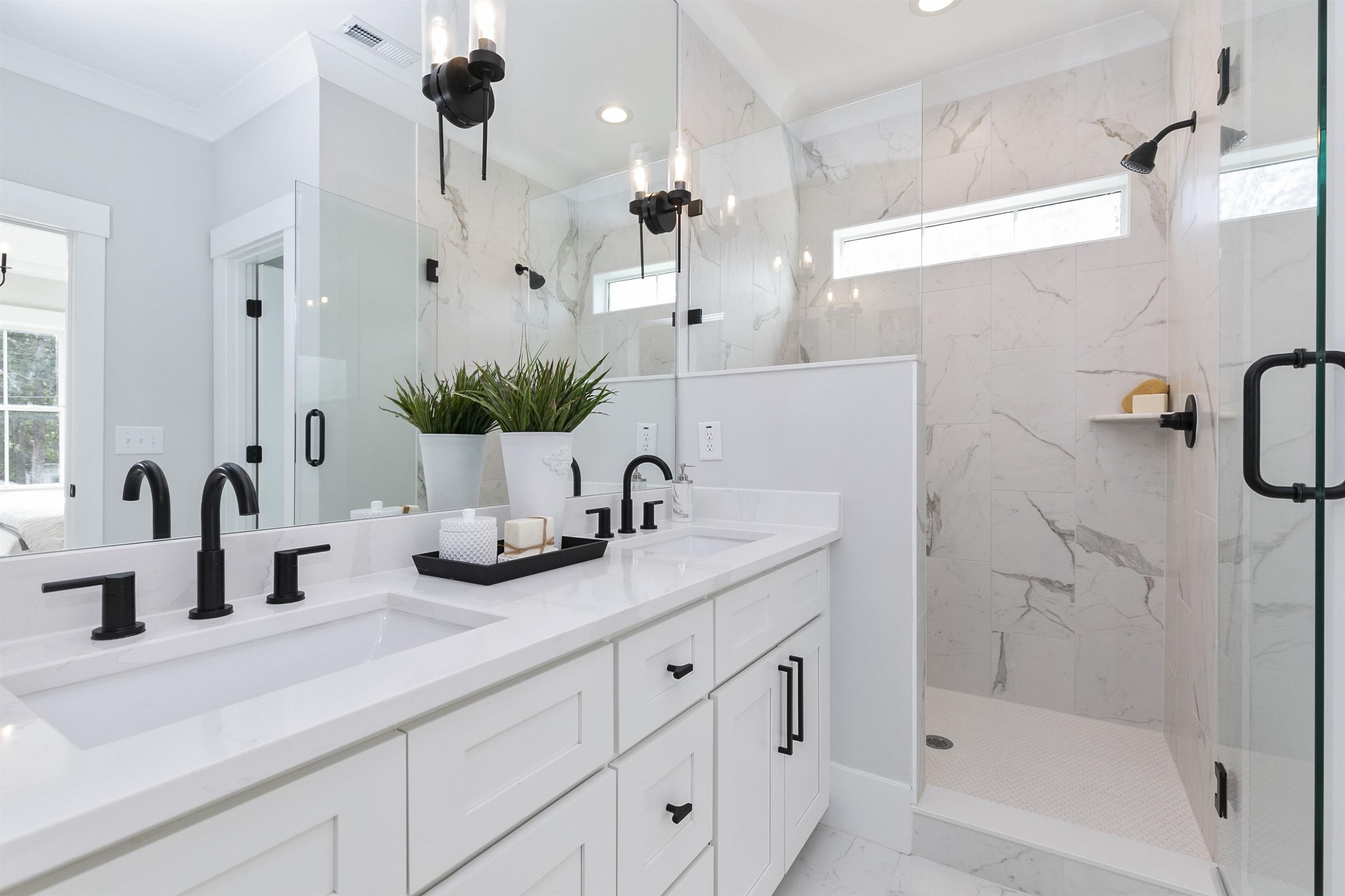 114 Summit Avenue Raleigh, NC 27603 - Photo 29 of 62 a bathroom with a double vanity sink window and shower